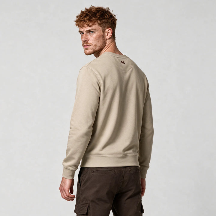 Side-back view of the beige organic cotton sweatshirt
