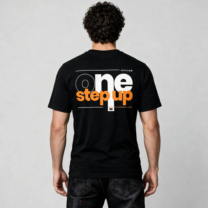 Back of the black organic cotton t-shirt with large one step up lettering in white and orange