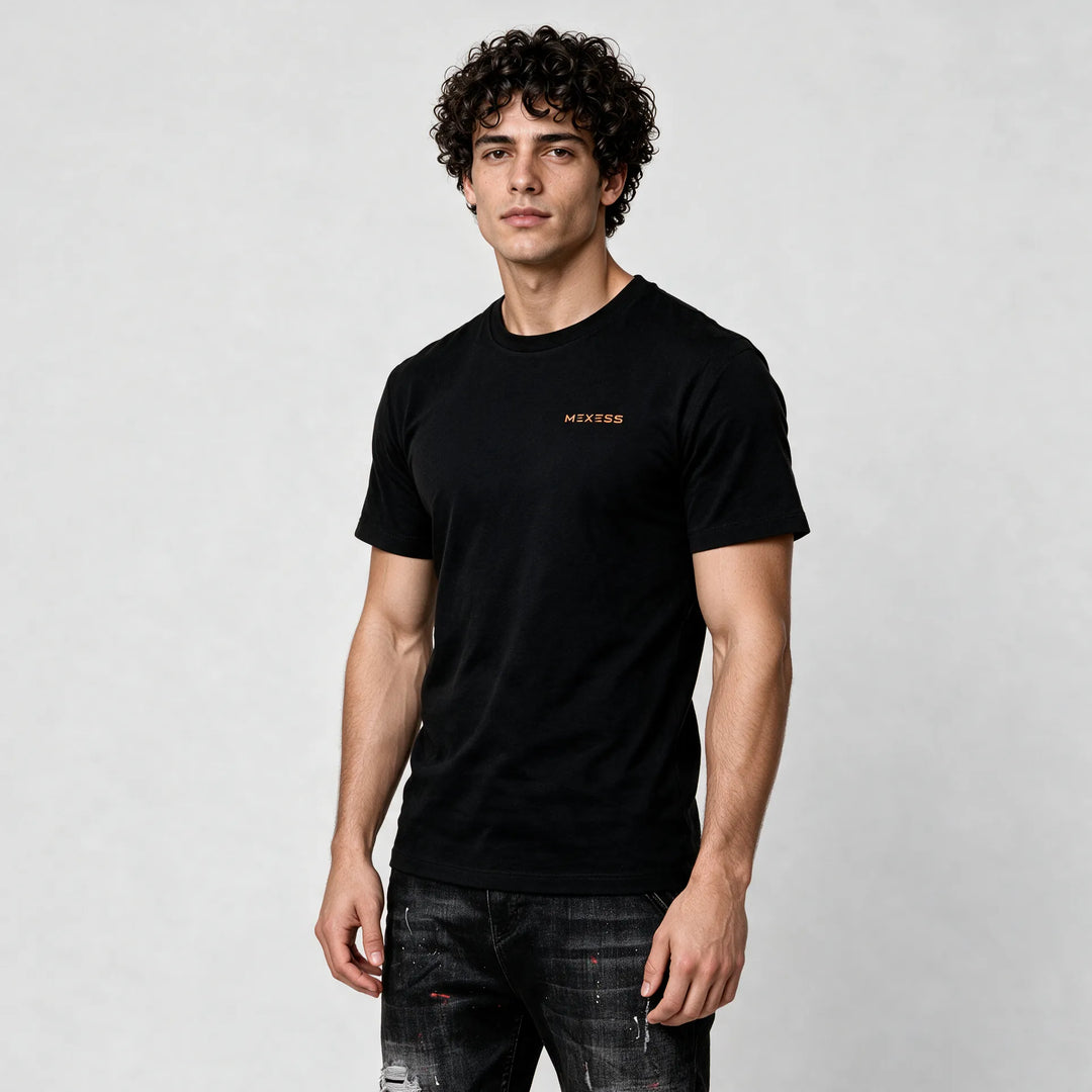 Man wearing the black t-shirt, three-quarter front view with a small orange MEXESS logo on the chest