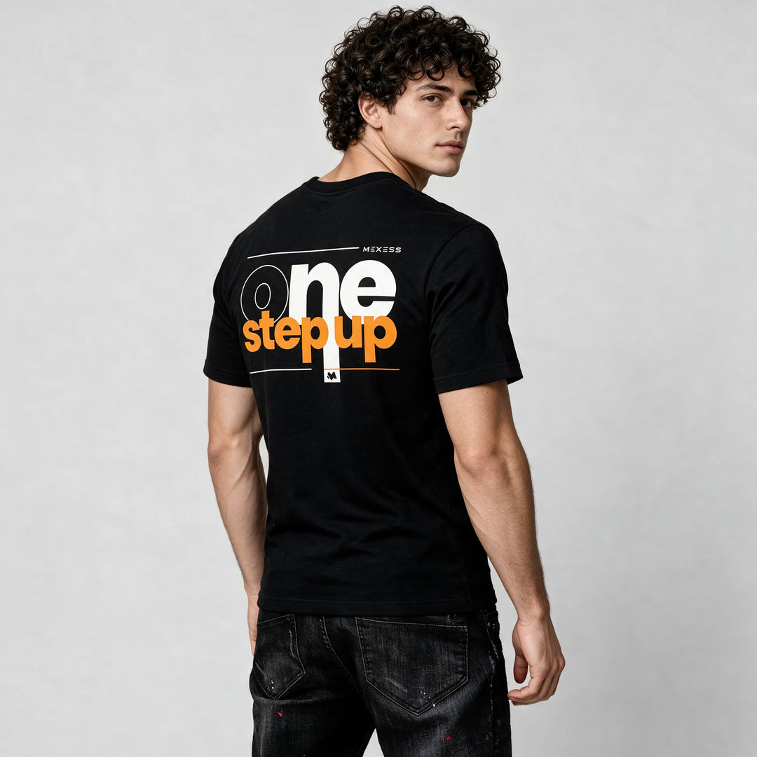 Black typography t-shirt for men, side-back view with white and orange One Step Up print