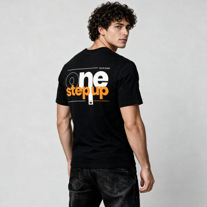 Black typography t-shirt for men, side-back view with white and orange One Step Up print