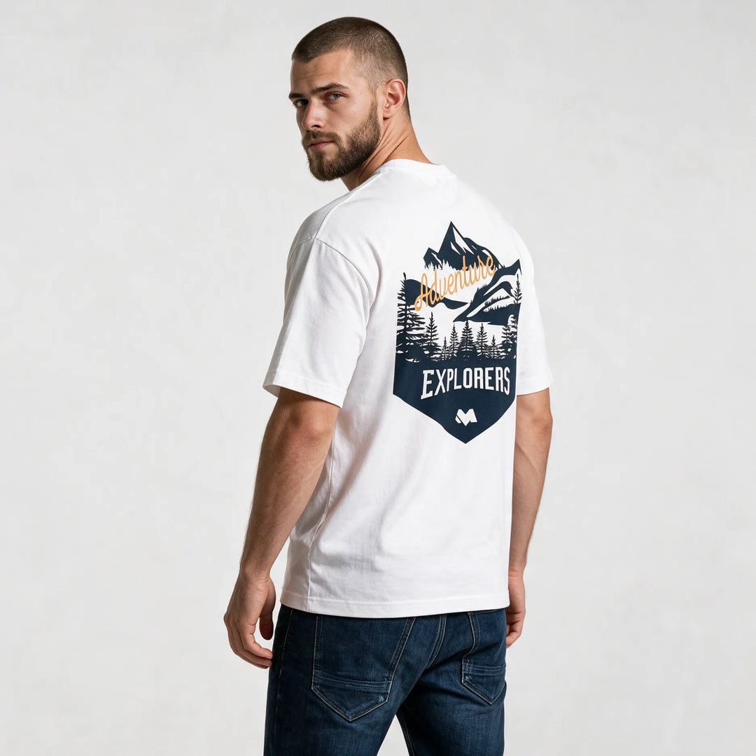 White t-shirt, three-quarter back view with the mountain, pine tree and Adventure script badge