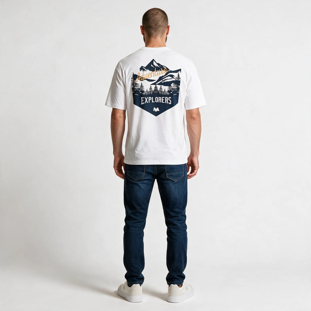 Full-length back view of the white t-shirt with the navy EXPLORERS badge