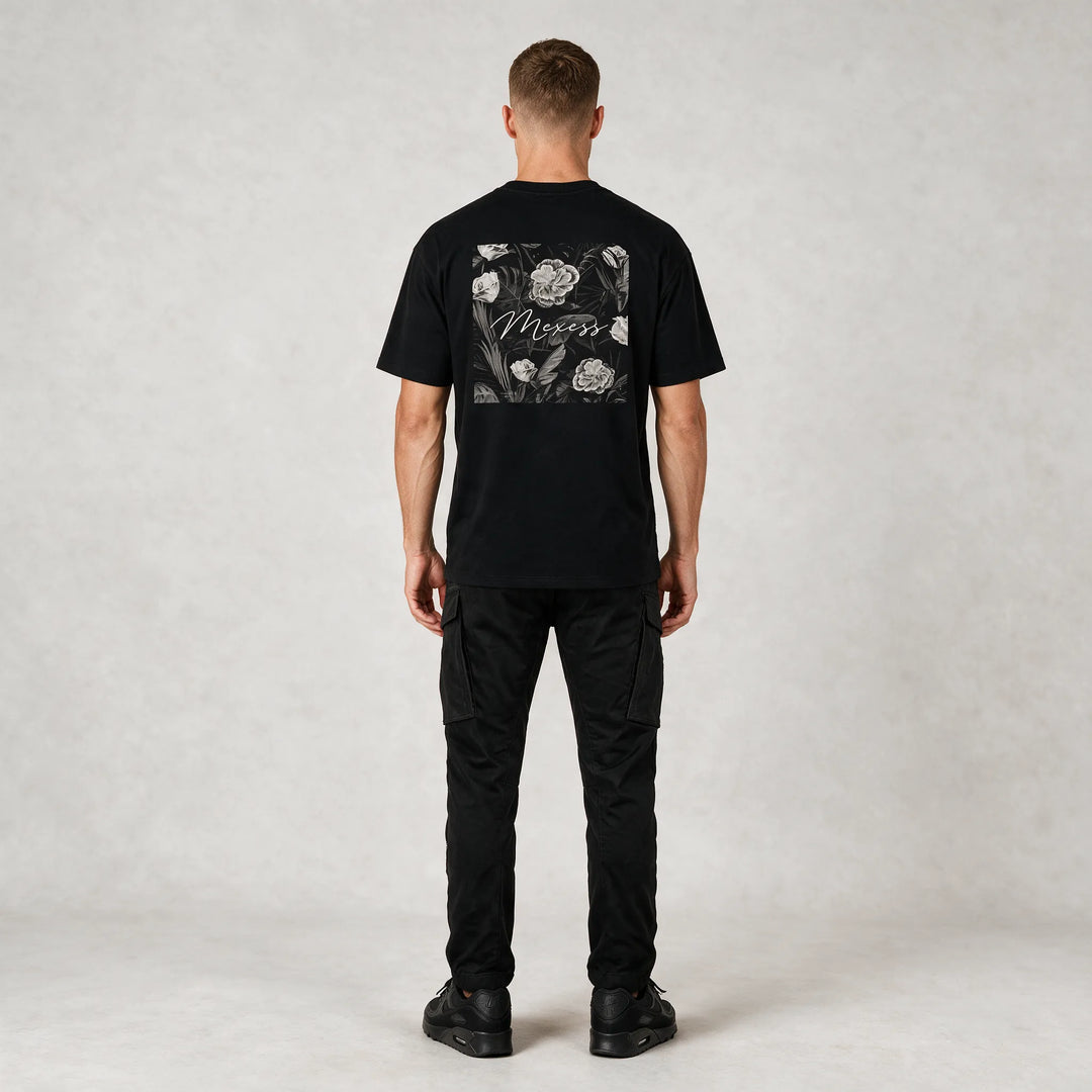 Full-length back view of a model wearing the t-shirt with black cargo pants