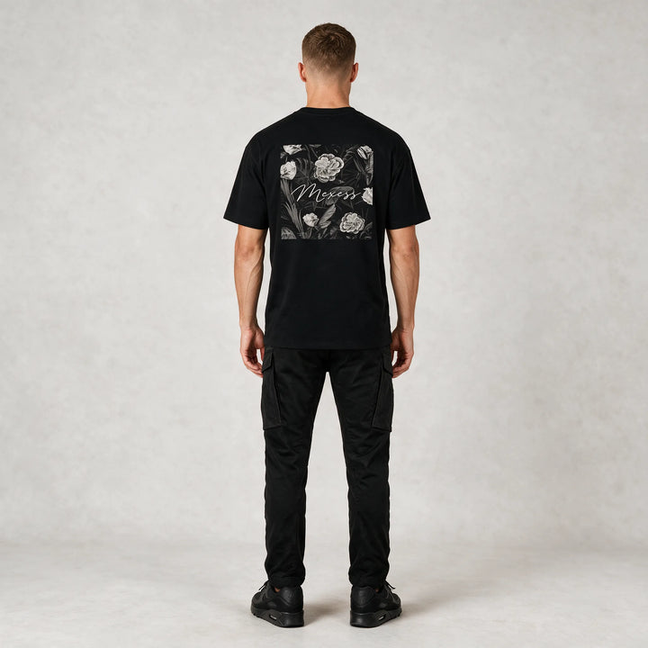Full-length back view of a model wearing the t-shirt with black cargo pants