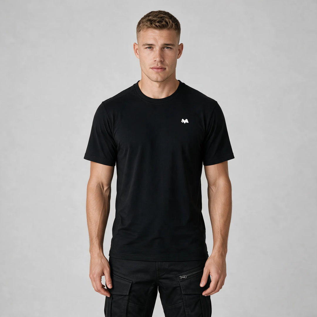 Front view of the black t-shirt worn with black cargo pants