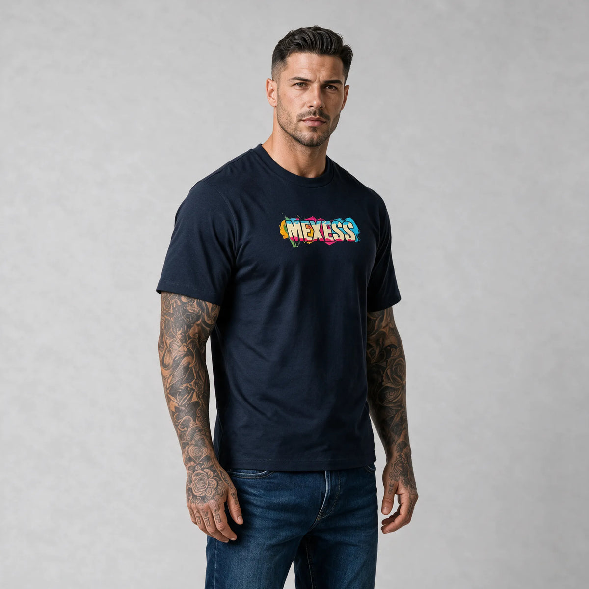 Colorful hand-drawn doodle print on a dark blue MEXESS t-shirt