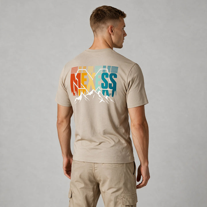Beige graphic t-shirt with sunset-colored lettering and white peaks