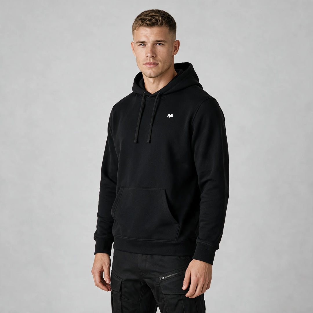Front view of a man in a black hoodie with a small white MEXESS logo on the left chest