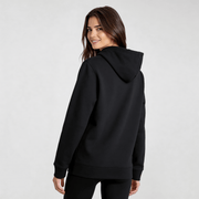 Woman wearing black streetwear hoodie DR673 with minimalist design, showcasing modern urban style and comfort.