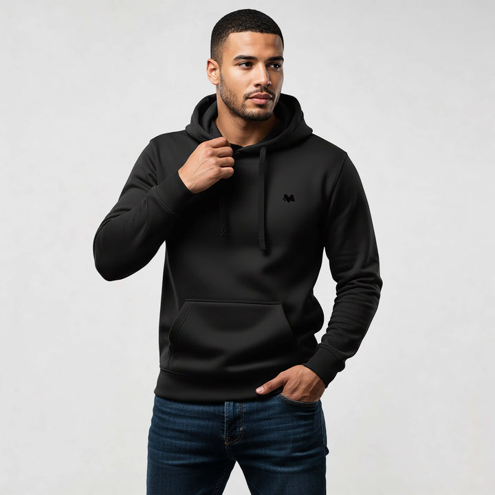 Man wearing Core Streetwear Hoodie DR679 in black, crafted from 100% organic cotton, showcasing modern streetwear style and comfort.
