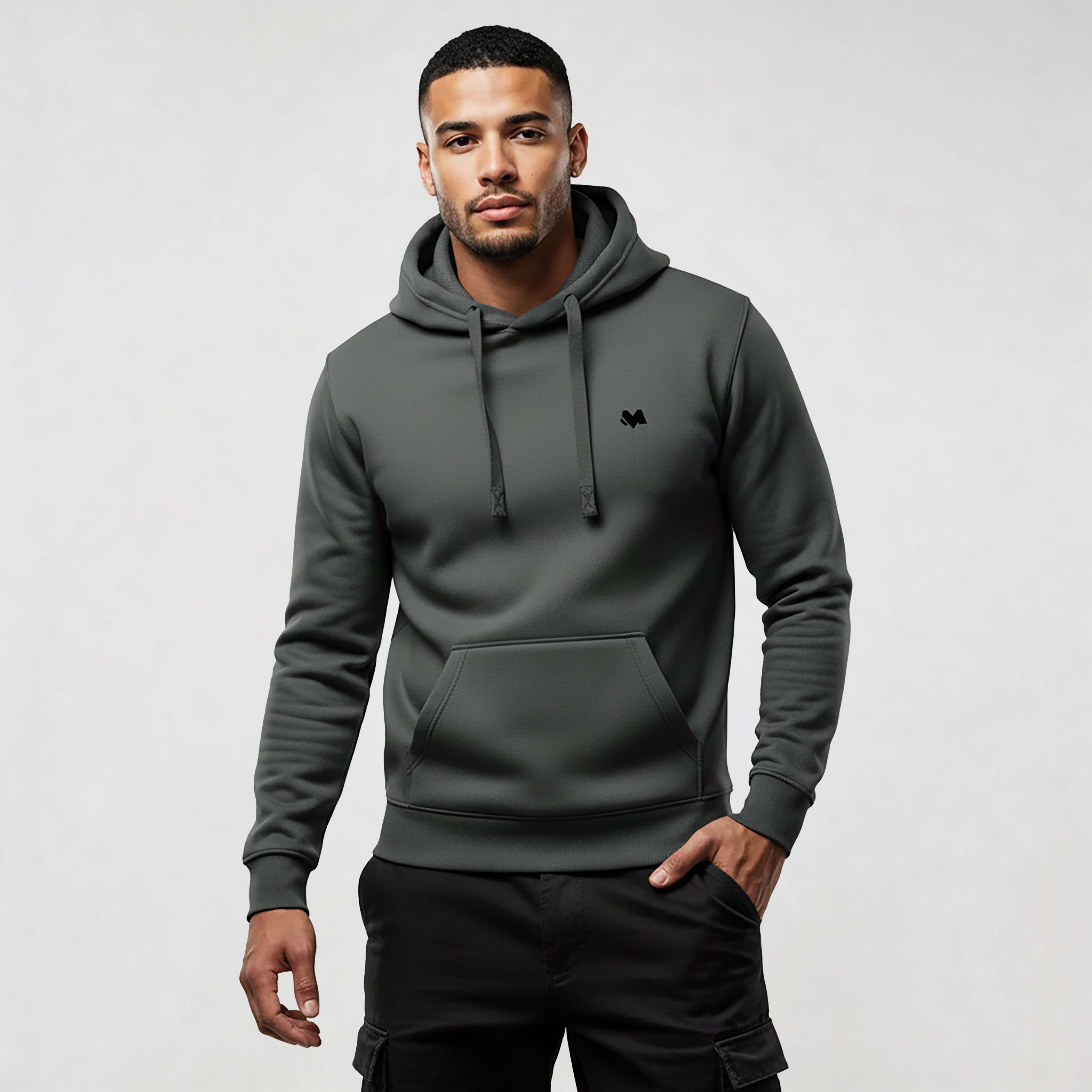 Man wearing MEXESS Organic Cotton streetwear hoodie in dark grey with modern design.