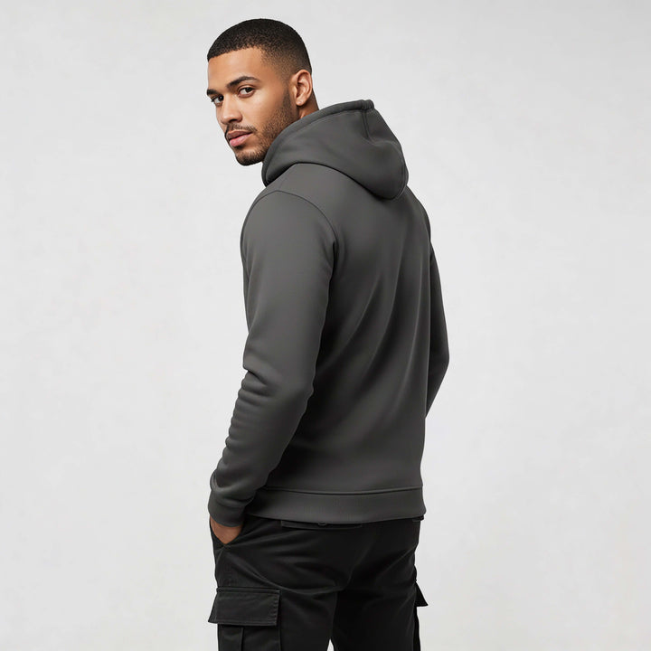 Model wearing Core streetwear hoodie DR679 in charcoal gray, crafted from 100% organic cotton for modern style and comfort.