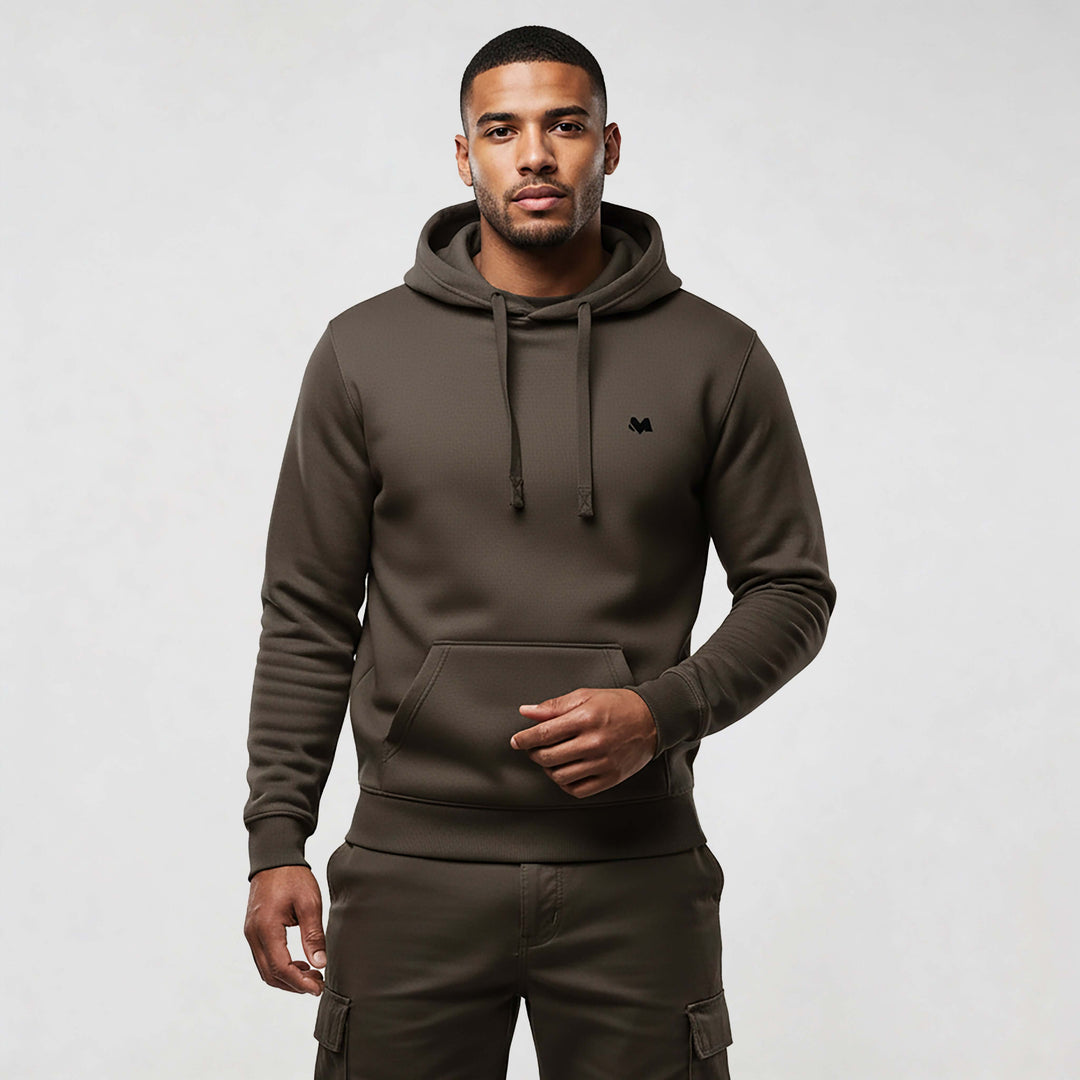 Model wearing MEXESS Organic Cotton streetwear hoodie in brown, showcasing premium style and comfort.