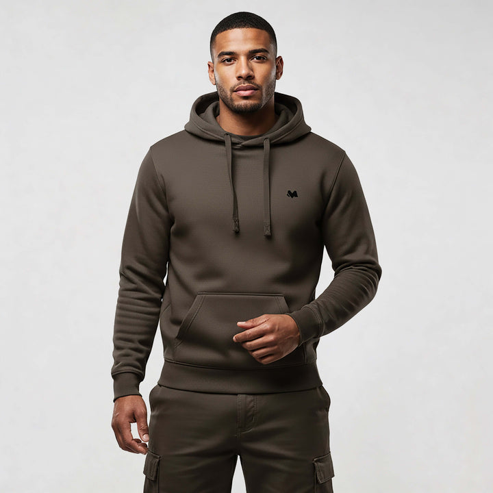 Model wearing MEXESS Organic Cotton streetwear hoodie in brown, showcasing premium style and comfort.