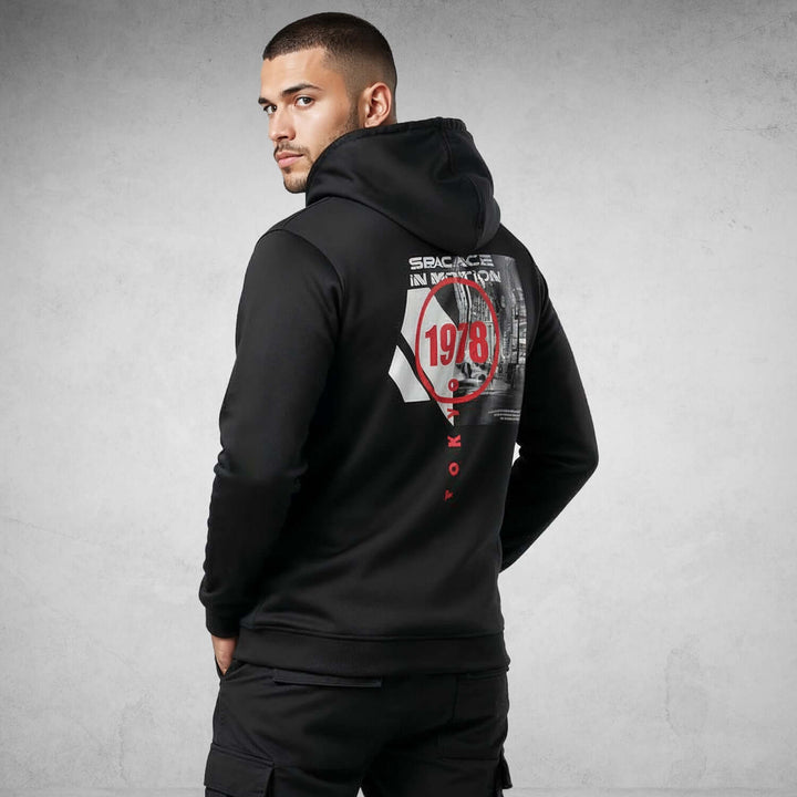 Man wearing Iconic Streetwear Hoodie DR709 with bold graphic design, showcasing premium organic cotton material.