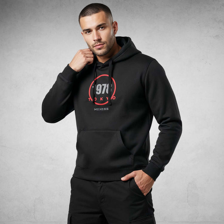 Man wearing Iconic Streetwear Hoodie DR709 by MEXESS, featuring bold graphics and modern design in premium organic cotton.