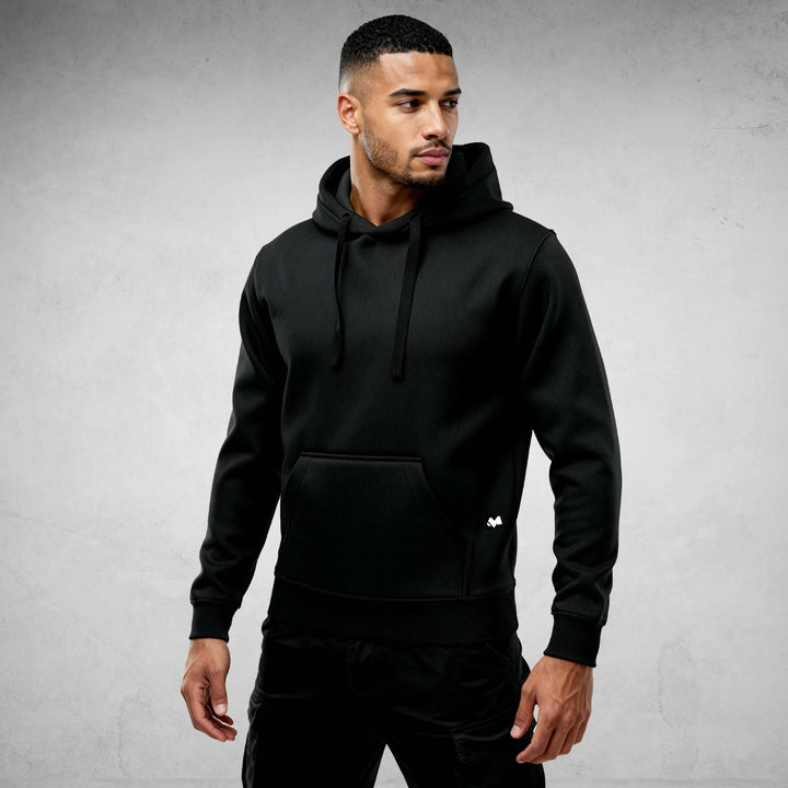 Man wearing Iconic Streetwear Hoodie DR712, black color, designed for comfort and style in urban life.