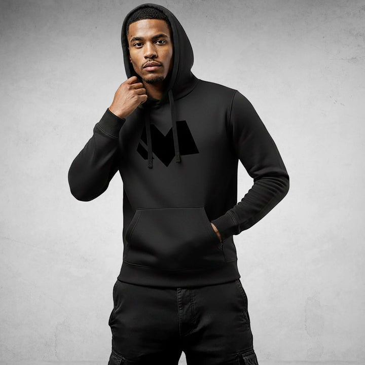 Man wearing Core Streetwear Hoodie DR680 made of 100% organic cotton, displaying modern style and comfort, in black.
