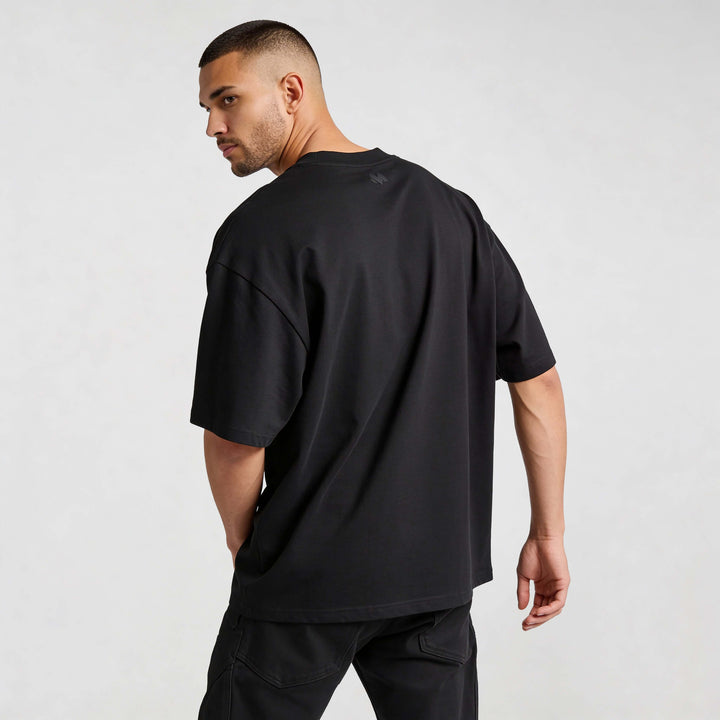 Alt Tag: Essential Oversized T-shirt BL720 oversized t-shirt in black, back view, heavyweight organic cotton streetwear fit