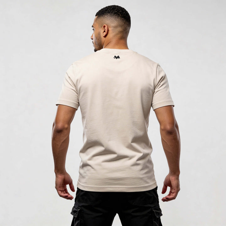 Back view of a man wearing an Iconic CR720 streetwear t-shirt in beige, showcasing modern streetwear aesthetics and premium comfort.