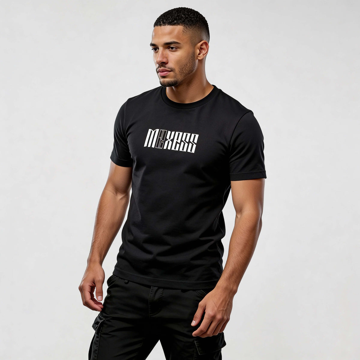 Model wearing black Iconic CR720 streetwear t-shirt by MEXESS, showcasing premium comfort and modern style for men.