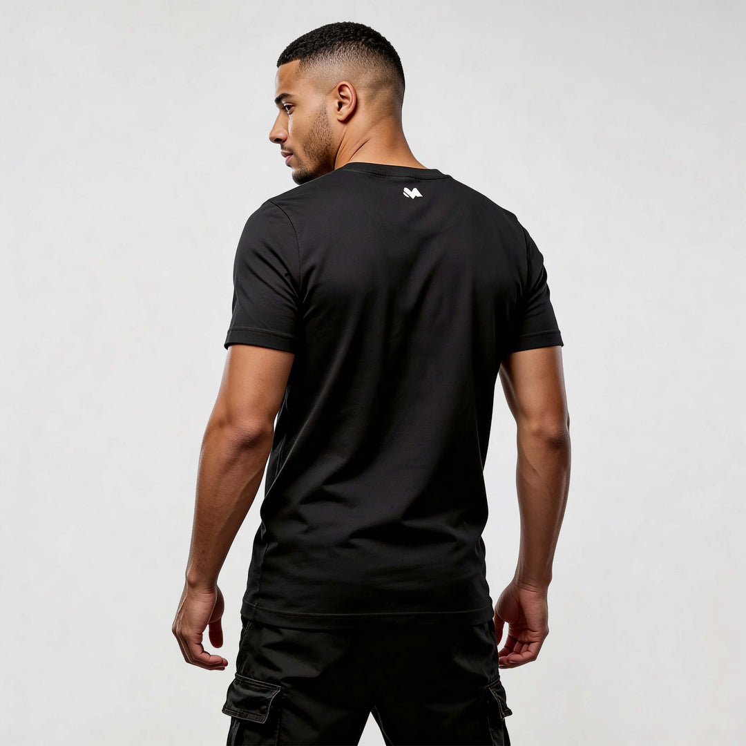 Back view of a model wearing a black streetwear t-shirt showcasing modern design and comfort.