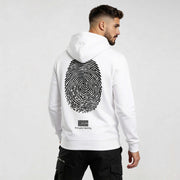Model wearing white streetwear hoodie with bold fingerprint graphic on back. Iconic design by MEXESS for modern style statement.