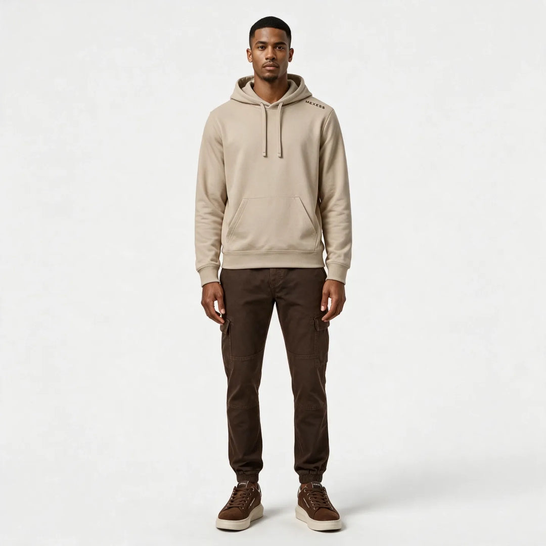 Full-length front view of the beige hoodie worn with dark brown cargo pants