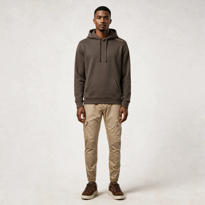 Full-length front view of the mocha hoodie worn with beige cargo pants
