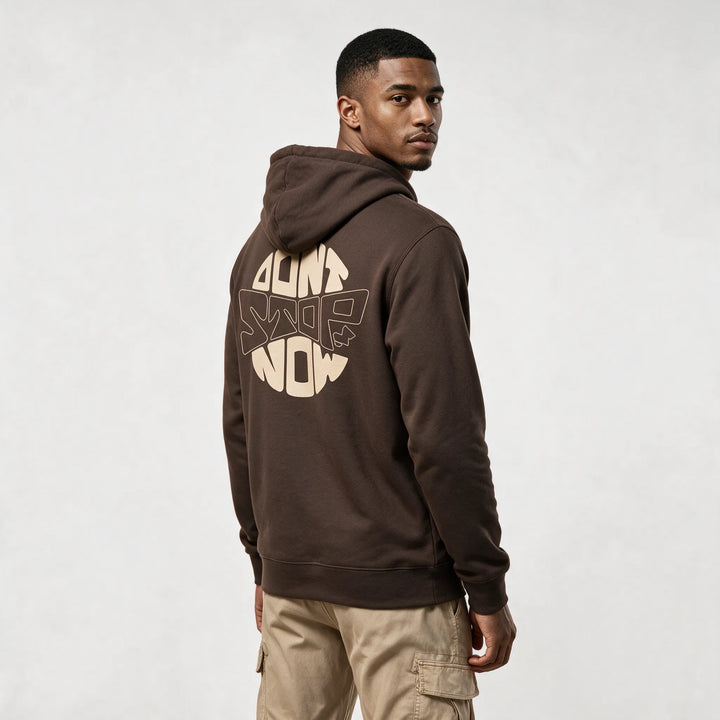 Mocha hoodie, three-quarter back view with a round beige DON&
