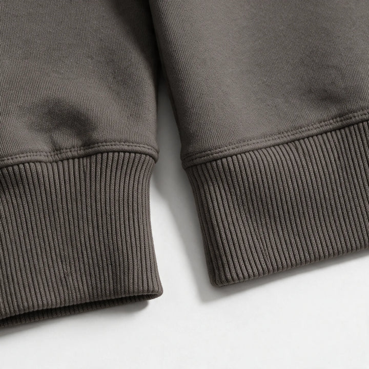 Close-up of the ribbed cuff and hem of the mocha organic cotton hoodie