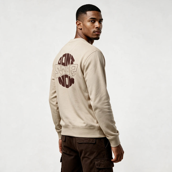 Beige sweatshirt, three-quarter back view with a round dark brown DON&