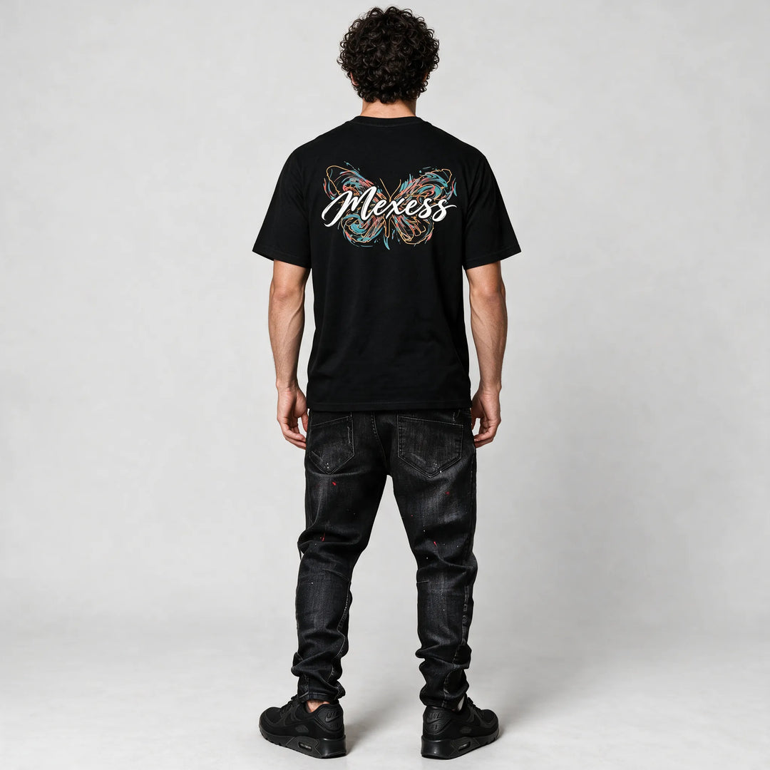 Full-length back view of the black t-shirt with the butterfly and script print