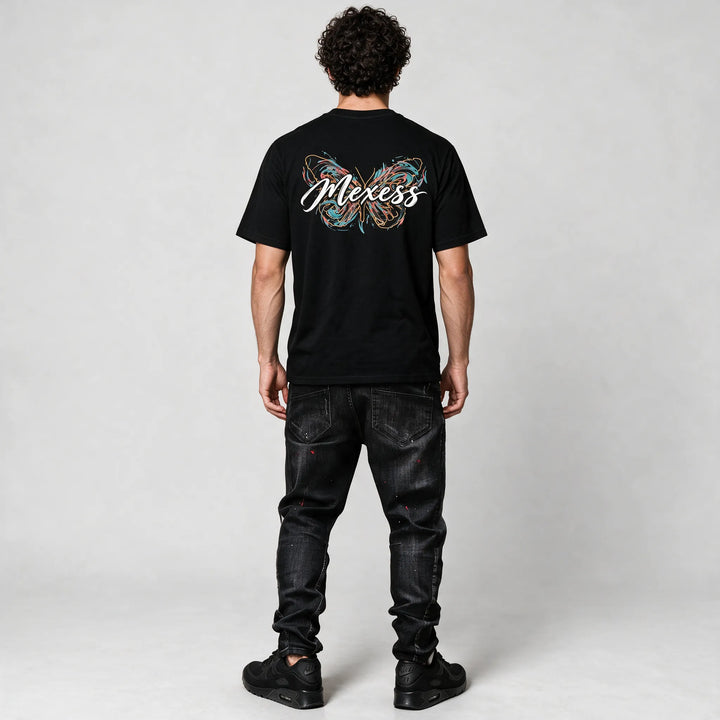 Full-length back view of the black t-shirt with the butterfly and script print