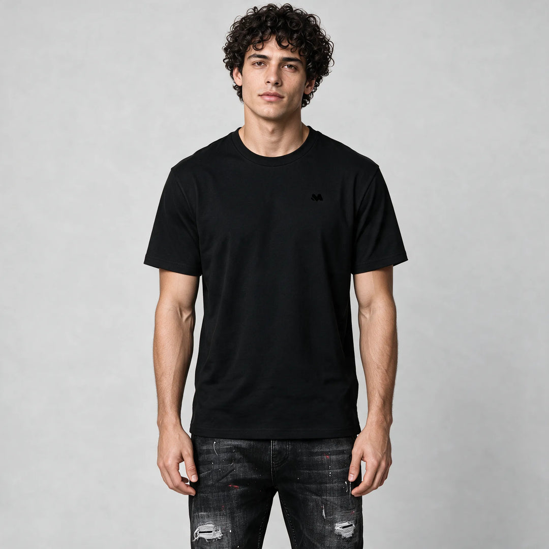Front of the black crew neck t-shirt with a small tonal M logo on the left chest