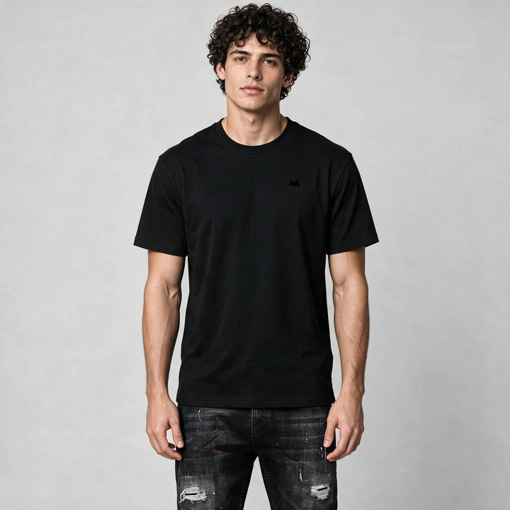 Front of the black crew neck t-shirt with a small tonal M logo on the left chest