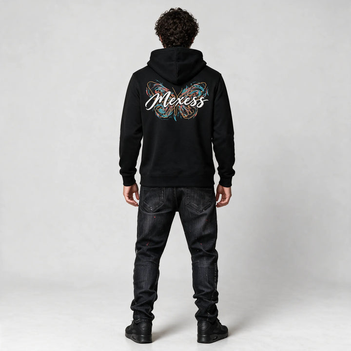 Full-length back view of the black hoodie with the butterfly and Mexess script print