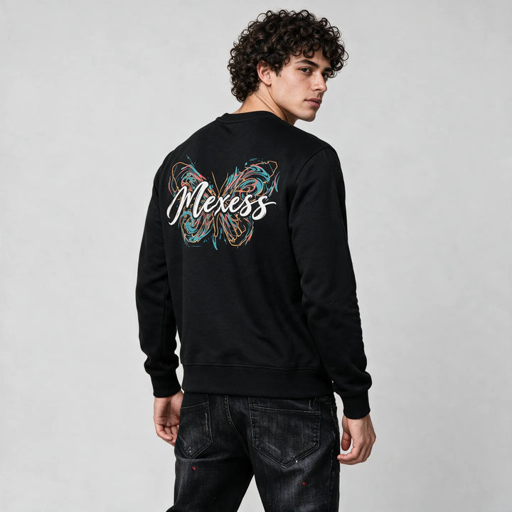 Side view of the back print on the black sweatshirt with ribbed cuffs