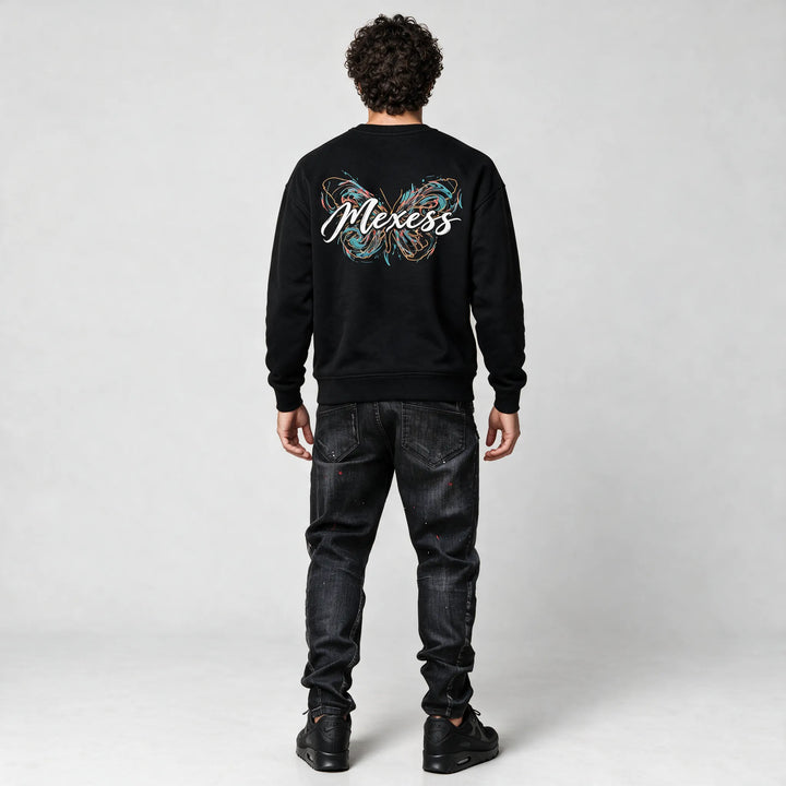 Full-length back view of the black sweatshirt with the butterfly and script print