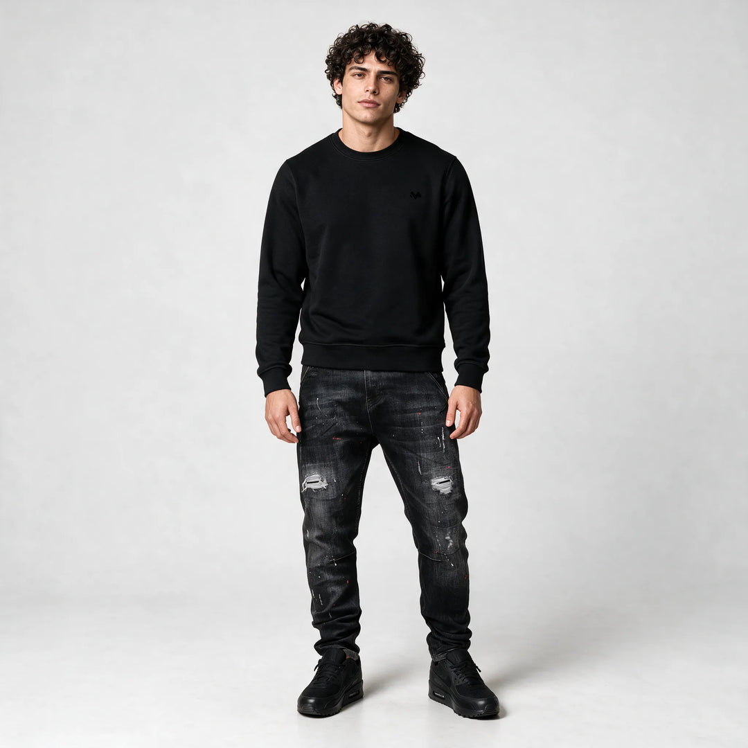Full-length front view of the black sweatshirt in a regular fit