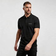 Alt Tag: Core CO689 polo shirt by MEXESS in black, men’s minimalist short-sleeve polo with embroidered logo, smart-casual fit