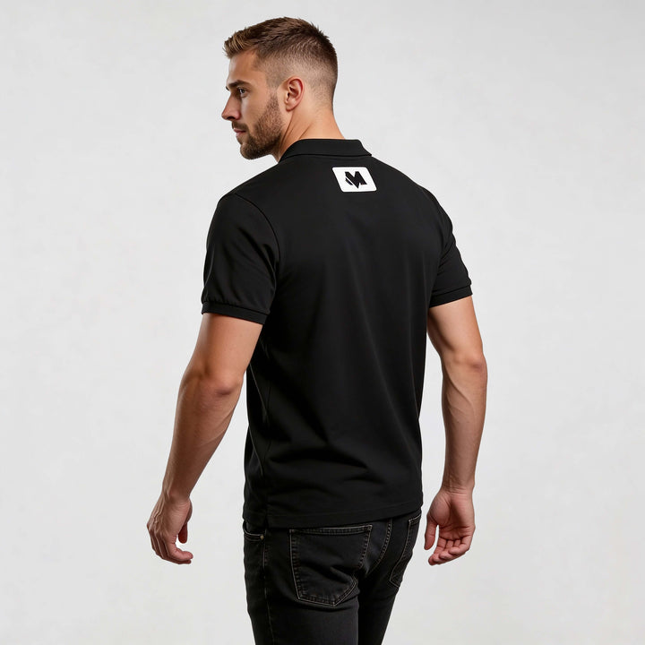 Core CO689 polo shirt by MEXESS, black men’s minimalist polo, back view with logo patch, smart-casual fit