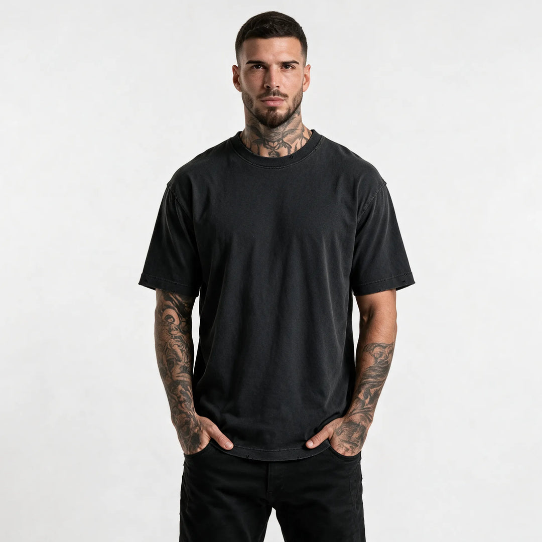 Heavyweight garment dyed t-shirt for men in washed black, front view in a relaxed fit