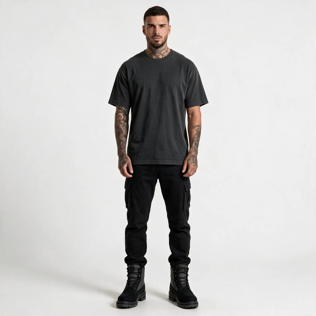 Full-length front view of the washed black t-shirt with black trousers