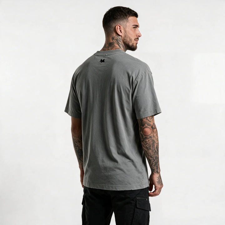 Back view of the gray t-shirt with a small M logo below the collar