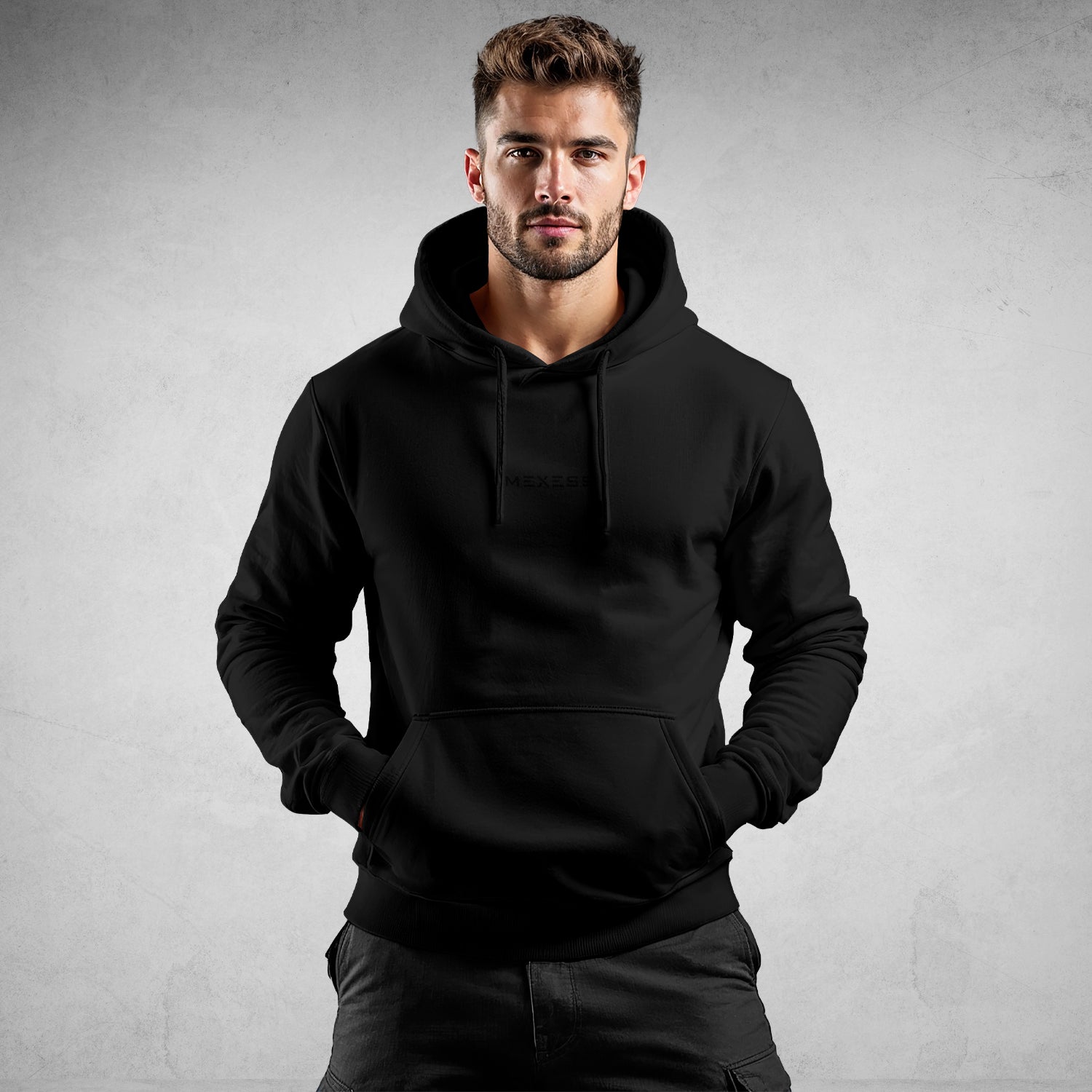MEXESS black pullover on male model with hands in pocket Men's Streetwear Hoodie fitted kangaroo pocket